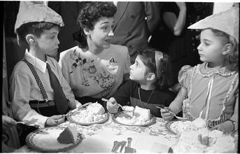 Deaf Children [Eating cake at a party.]