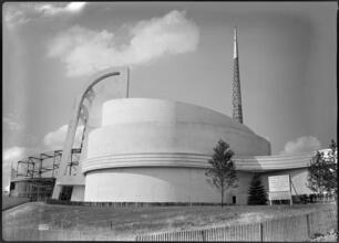 [Construction of Electrical Products building with frame of Trylon in background, New York World's Fair site.]