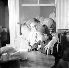 Boy and Mother at a Table