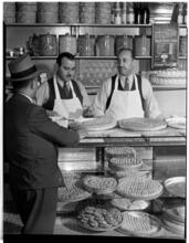 [Men at bakery.]