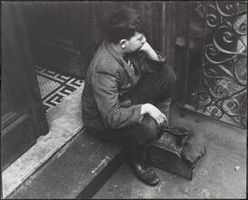Shoeshine Boy in Deep Worried Thought.