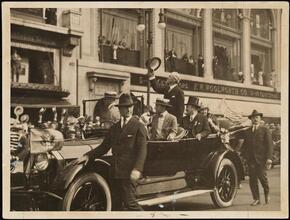[President Woodrow Wilson, Mayor John F. Hylan and Mrs. Wilson in a parade.]
