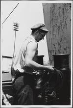 [Crew member on the ferry.]