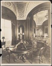 [Interior, possibly a parlor or study.]