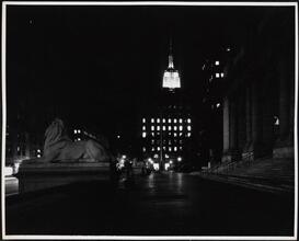[Looking south from the steps of New York Public Library's main branch toward the Empire State Building.]