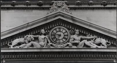 [Detail of the pediment and clock over the entrance to the Bowery Savings Bank, 130 Bowery.]