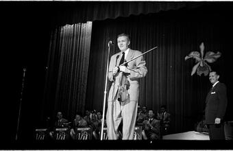 Vaughn Monroe [Man performing on stage.]
