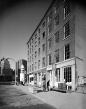 [Titanic Memorial Lighthouse and stores on Fulton Street.]