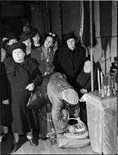 [Women at a Greek Orthodox church service.]