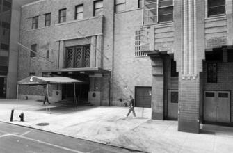 [Washington Street façade of Downtown Athletic Club and 21 West Street.]