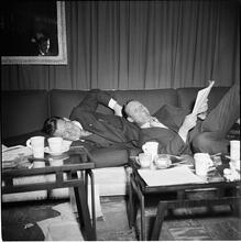 Arthur Godfrey [Godfrey and another man laying on a couch.]