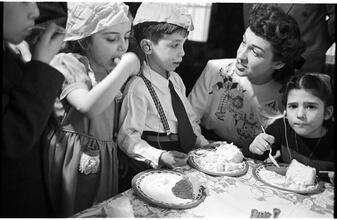 Deaf Children [Eating cake at a party.]