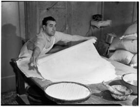 [Man baking.]