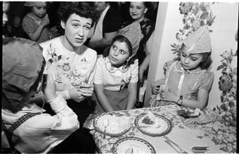 Deaf Children [Children eating cake at a party.]