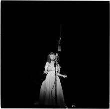Swing Band Contest Sponsored by LOOK [Woman singing on stage.]