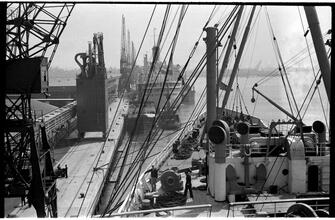 [Ships and boats at dock.]