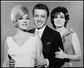 [Paula Stewart as Laurette Harrington, Steve Lawrence as Sammy Glick and Bernice Massi as Kit Sargent in "What Makes Sammy Run?".]