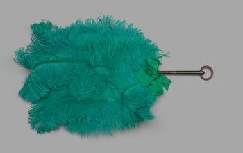 Lyre-shaped feather fan of green ostrich