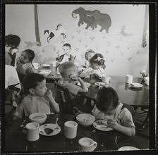 Orphanage [Children eating at tables.]