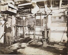 [Worker in the basement of the Rivington Street public baths.]