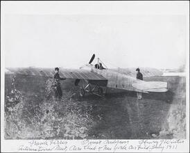 [Frank Ferris, Ernest Anderson, and Henry Winter with plane.]