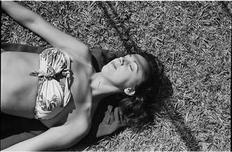Circus [Circus performer sunbathing.]