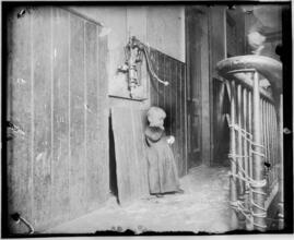 Baby in slum tenement, dark stairs--it's playground.