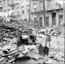 Boys Gathering Wood from Wreckage