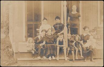 [Al Smith and his wife, Catherine, with family on a porch.]