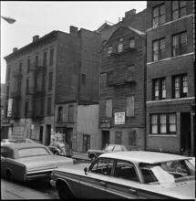 [Old wood framed house and carriage house, 203 East 29th Street.]