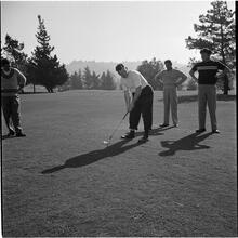 Arthur Godfrey [Godfrey playing golf.]