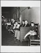 [People socializing at Ellis Island.]