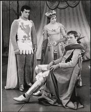 [Robert Goulet as Lancelot Du Lac, Julie Andrews as Guenevere, and Richard Burton as Arthur in Act 1, Scene 5 of "Camelot".]