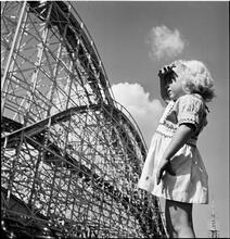 Palisades Amusement Park [Girl watching a roller coaster.]