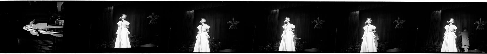 Vaughn Monroe [Monroe on stage and a woman singing on stage.]