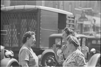 Street Conversations [Three women talking on the street.]