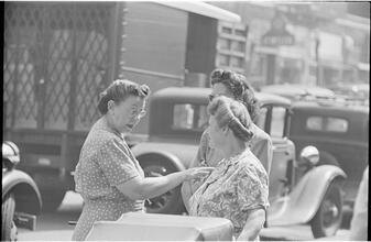 Street Conversations [Three women talking on the street.]