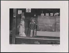Niño en Botanica (East side of Lexington Avenue between 111th & 112th Streets.)