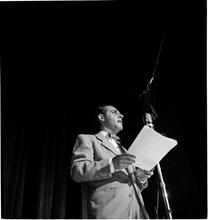 Swing Band Contest Sponsored by LOOK [Man on stage.]