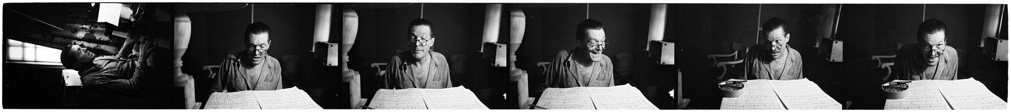Peter Arno [Arno playing piano and reading sheet music.]