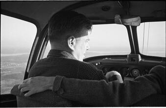 Arthur Godfrey [Godfrey flying an airplane.]