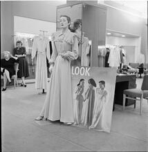 Lord & Taylor Display [A mannequin dressed in a housecoat in front of a LOOK magazine poster.]