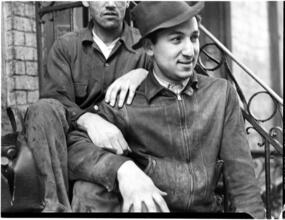[Men on steps.]