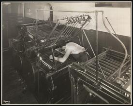 Unz & Co., Printers and Stationers, Second Floor, Man Adjusting Form in Press.