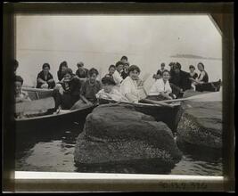[Group of young people in row boats.]