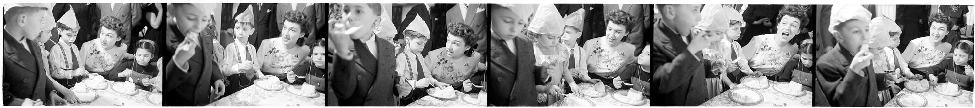 Deaf Children [Eating cake at a party.]