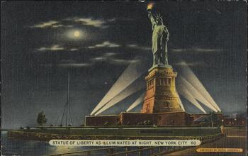 Statue of Liberty as Illuminated at Night, New York City.