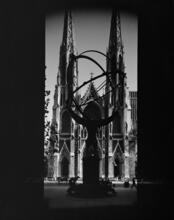 [View through "Atlas" in Rockefeller Center to St. Patrick's Cathedral.]