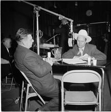 Arthur Godfrey [Arthur Godfrey interviewing a man for his radio show.]