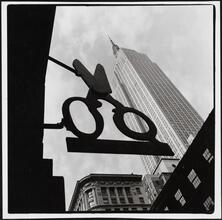 [Looking up at the Empire State Building.]